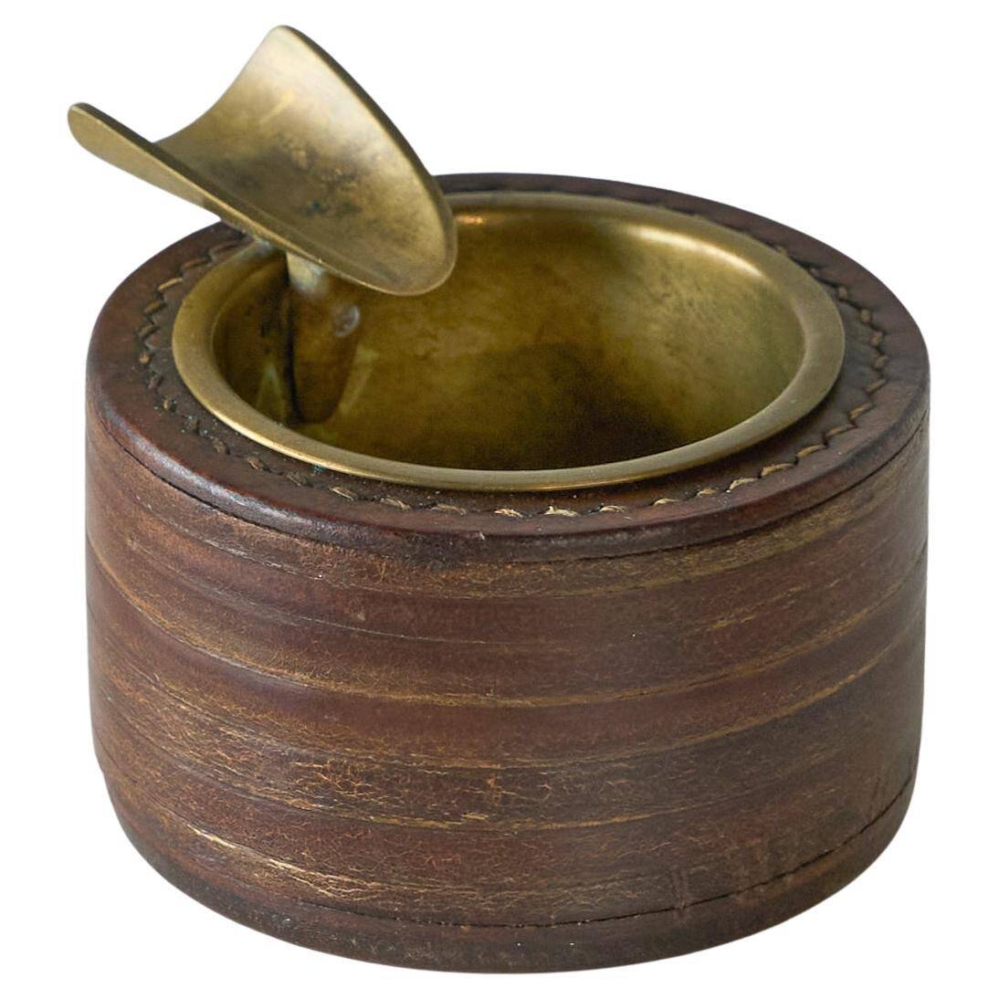 Vintage leather and patinated brass ashtray, 1960s, mid-century design.