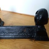 Cast iron andirons with character heads