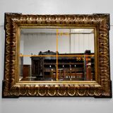 Gold-tinted wooden and stucco rectangular mirror - 1920