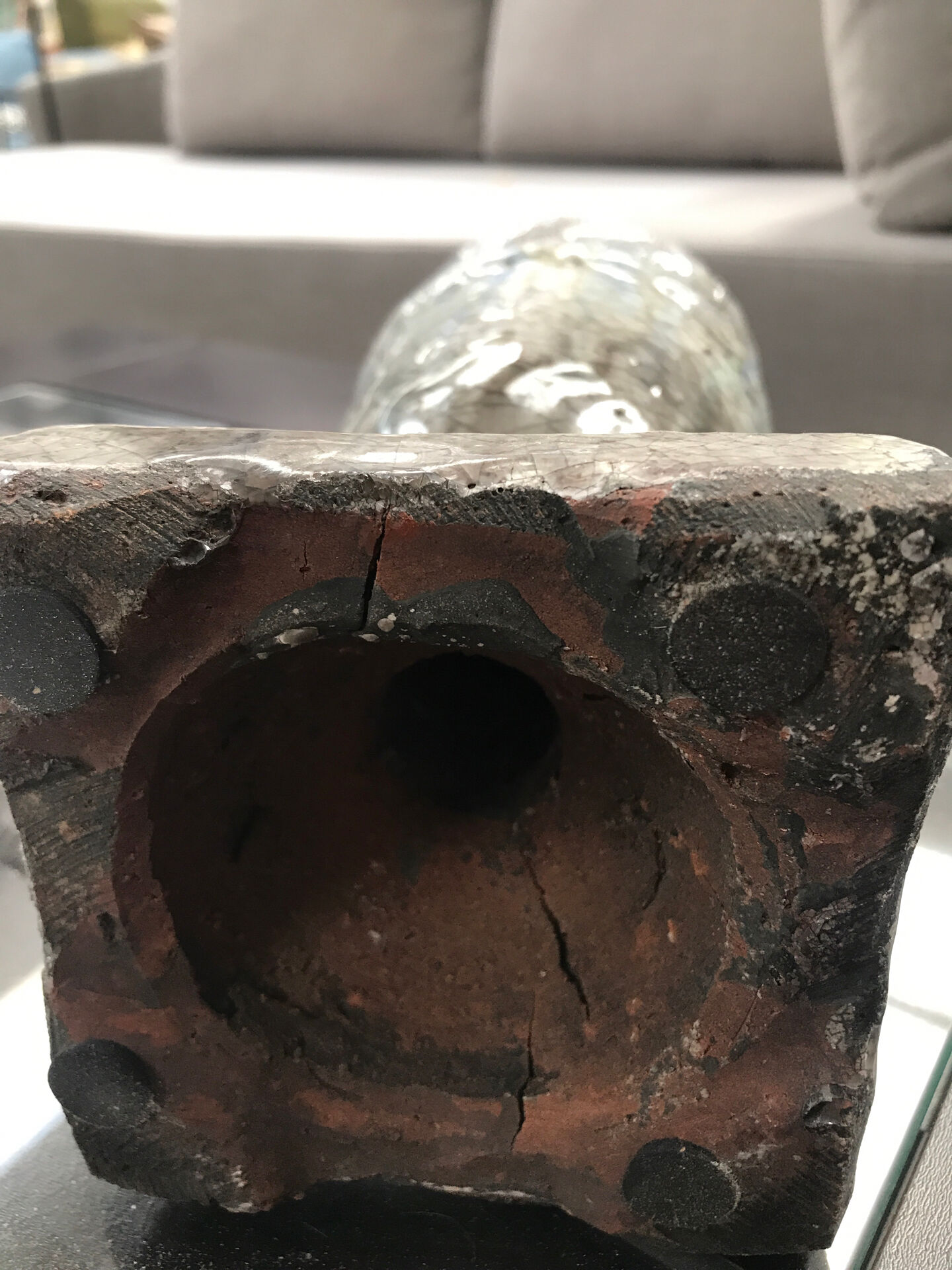 Ceramic candle holder in "Raku" style, blue-grey crackled.