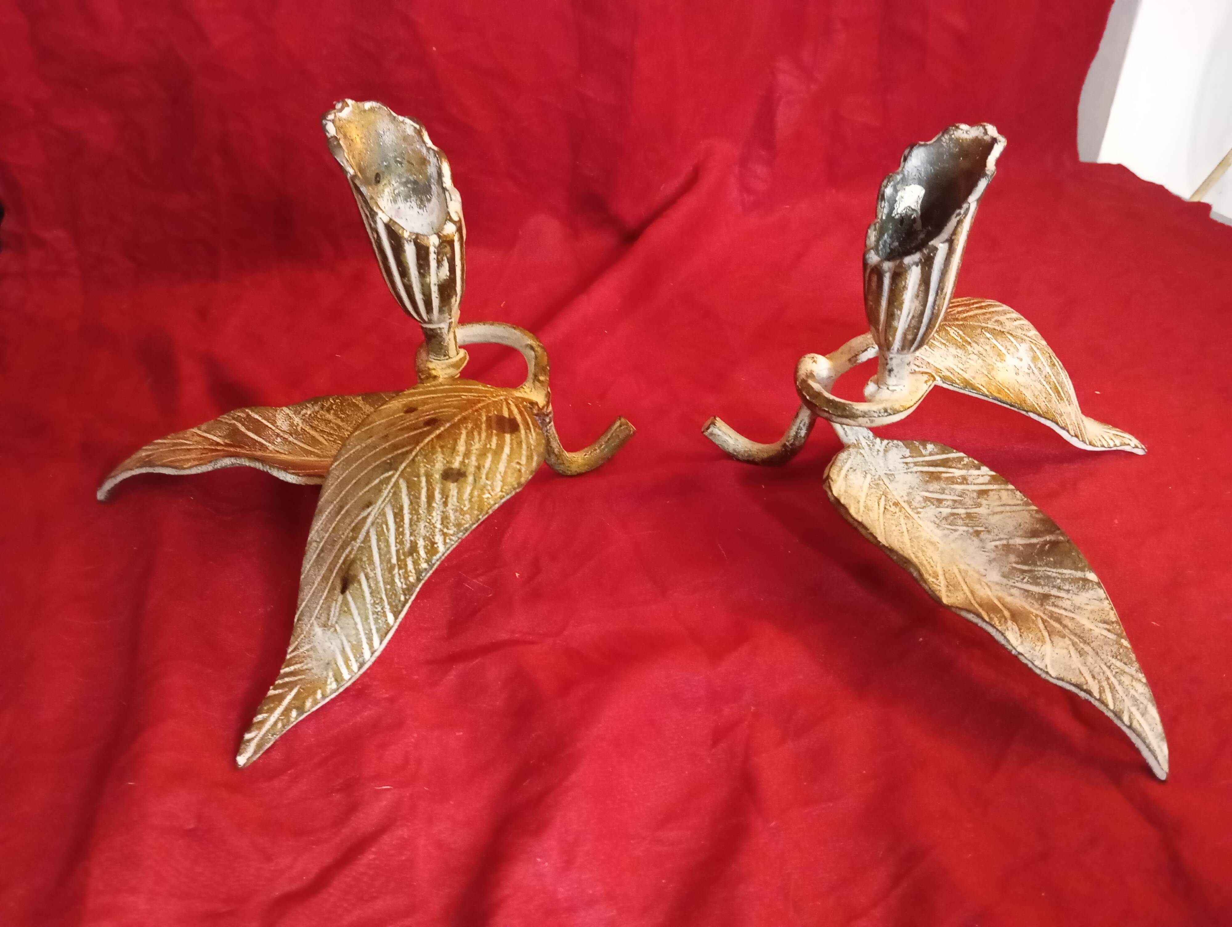 Pair of patina metal candle holders