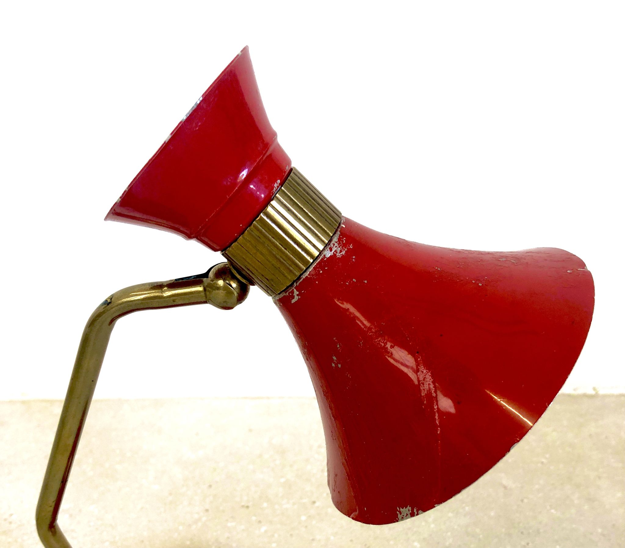 Brass desk lamp with articulated red diabolo lampshade