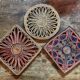 3 woven straw trivets