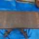 Round table in molded and carved oak with quill decoration, central shaft with 4 runners