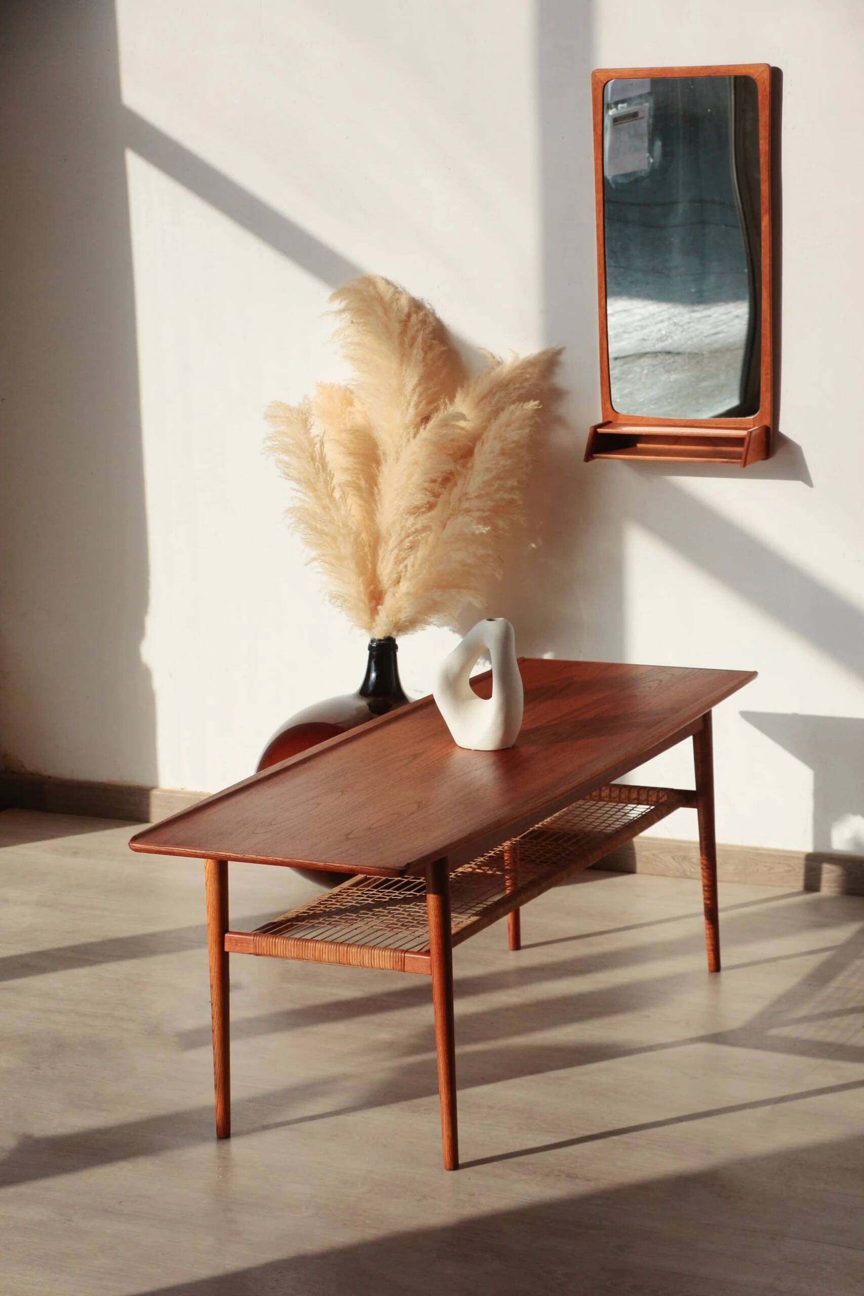 Vintage Scandinavian coffee table in teak and rattan – Danish design from the 1960s.