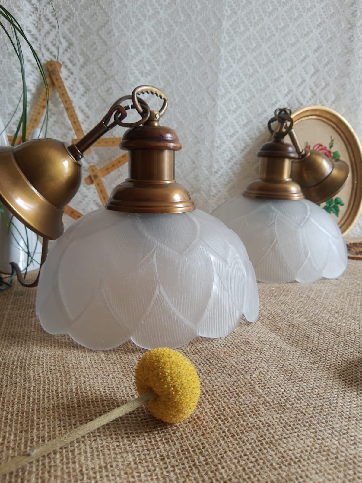 Pair of frosted glass flower pendant lights with vintage wood and brass