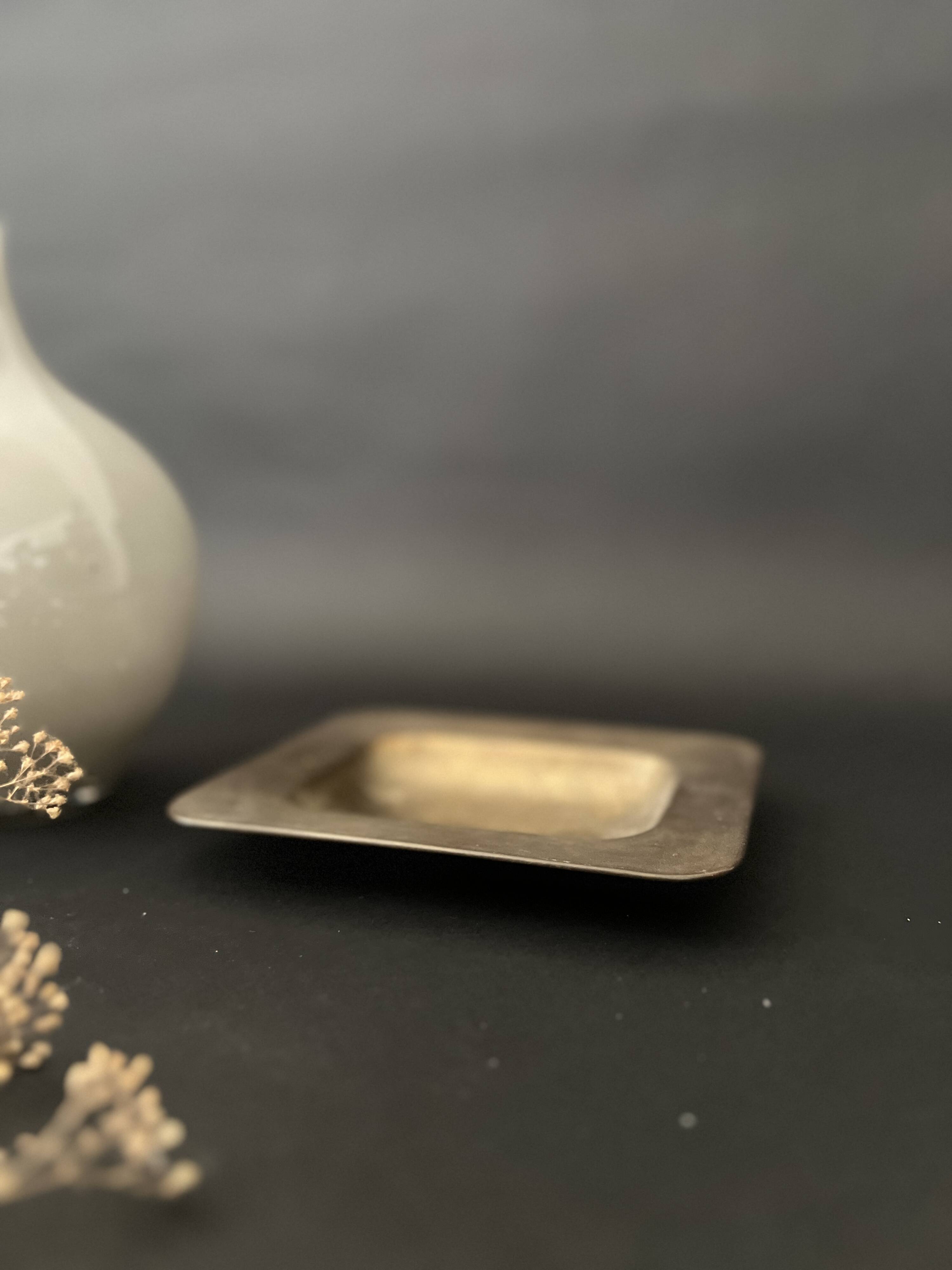 genuine brass pocket emptier, circa 1960