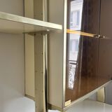 Wall-mounted and modular bookcase in lacquered brass, mirrors and smoked glass by Mahey, Design 1970