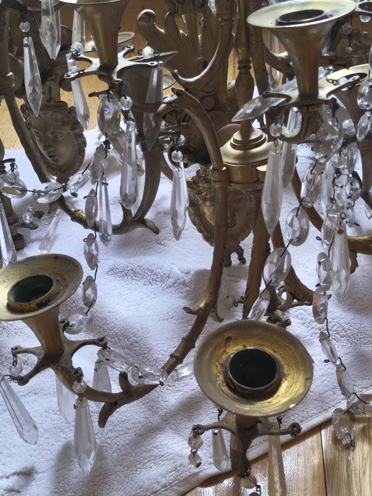 Gilded bronze wall lights with crystal pendants