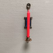 Wall-mounted candle holder in cast iron and hard pressed blue glass.
