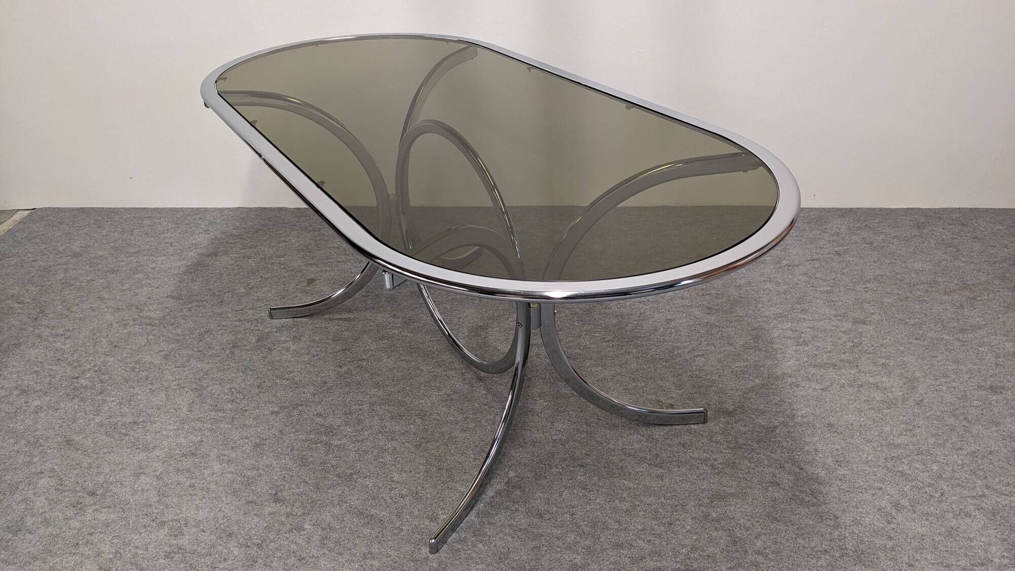 Oval dining table in chromed metal and smoked glass, Italy circa 1970