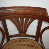 Wooden armchair with caned base