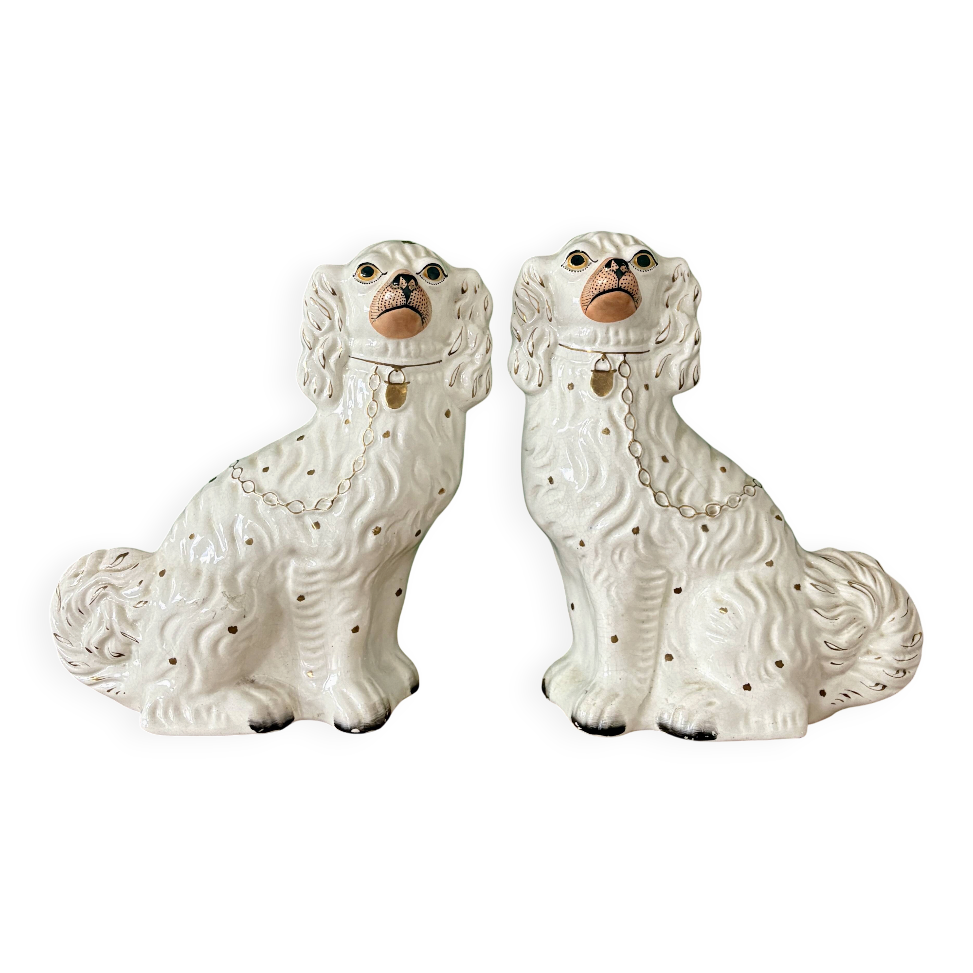 Pair of Staffordshire-type dogs in white and gold ceramic