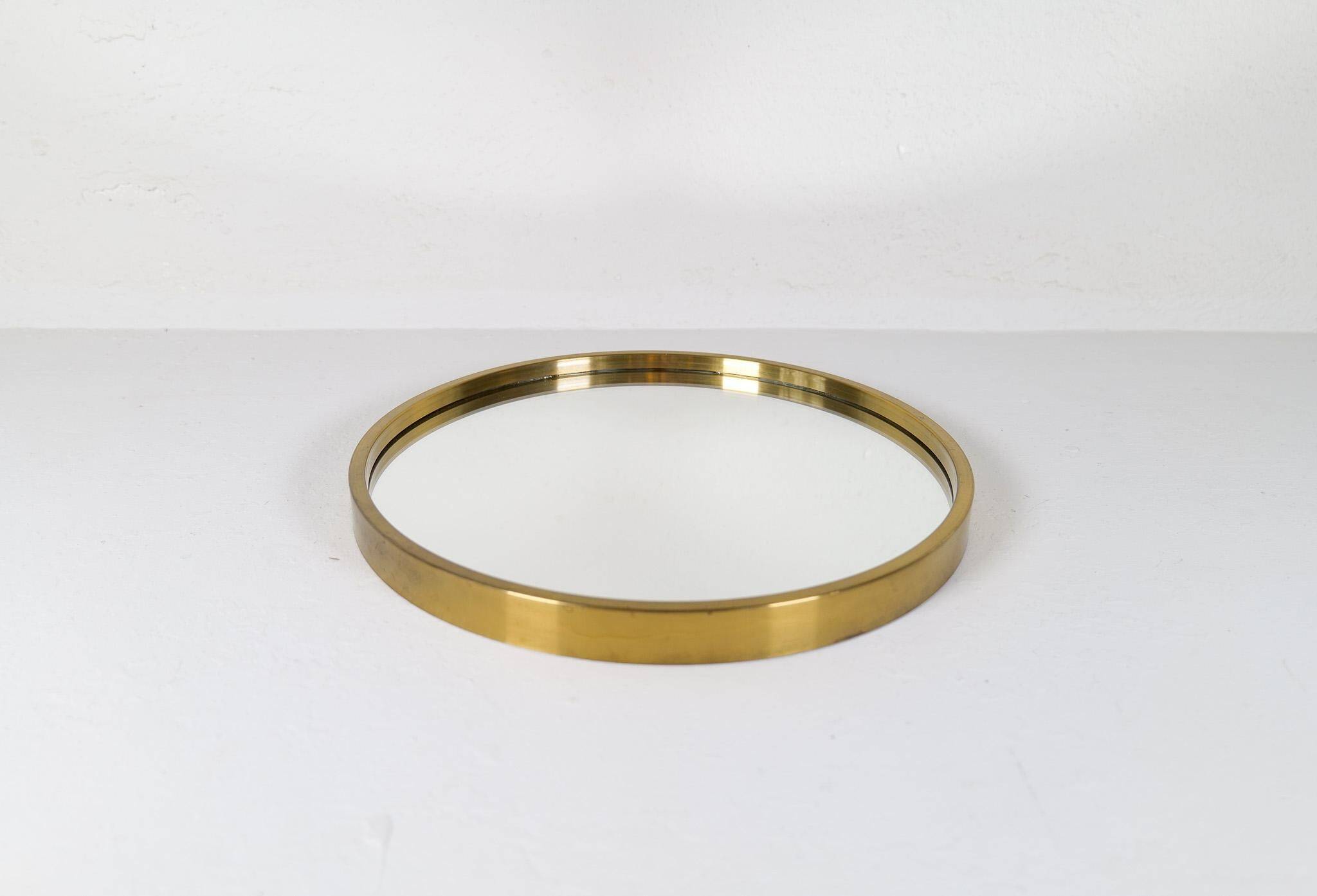 Round brass mirror from the mid-century by Glasmäster in Markaryd, Sweden, 1960s.