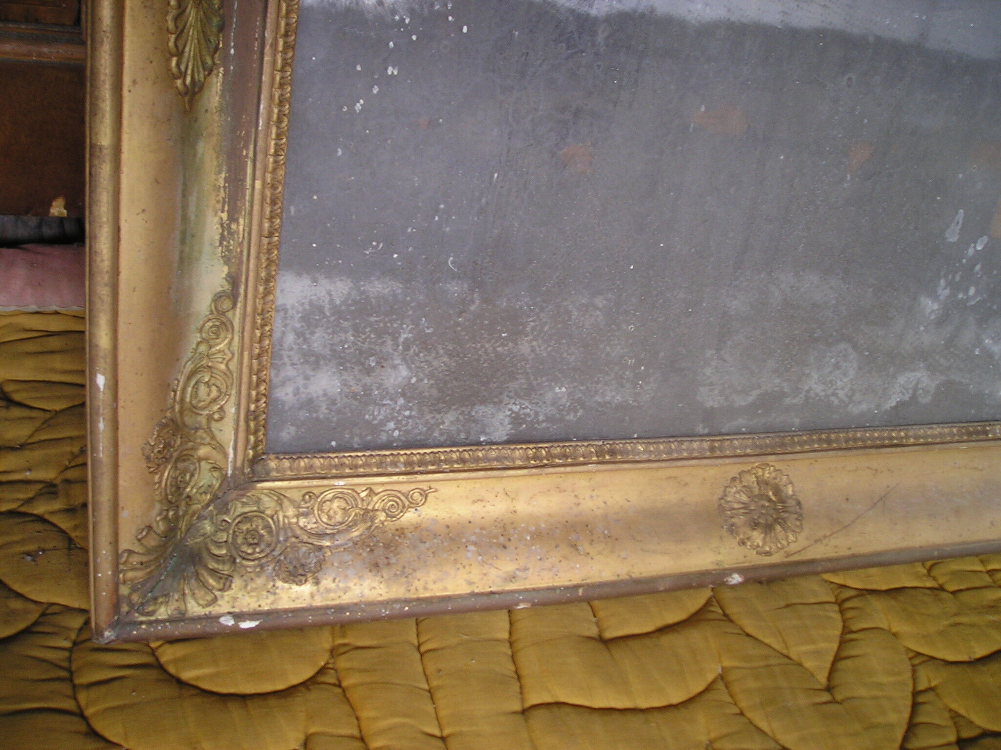 Antique wooden mirror and gilded stucco with gold leaf 89 x 72