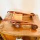 Vintage wooden folding doll's deckchair on wheels