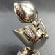 Individual ashtray with metal clasp