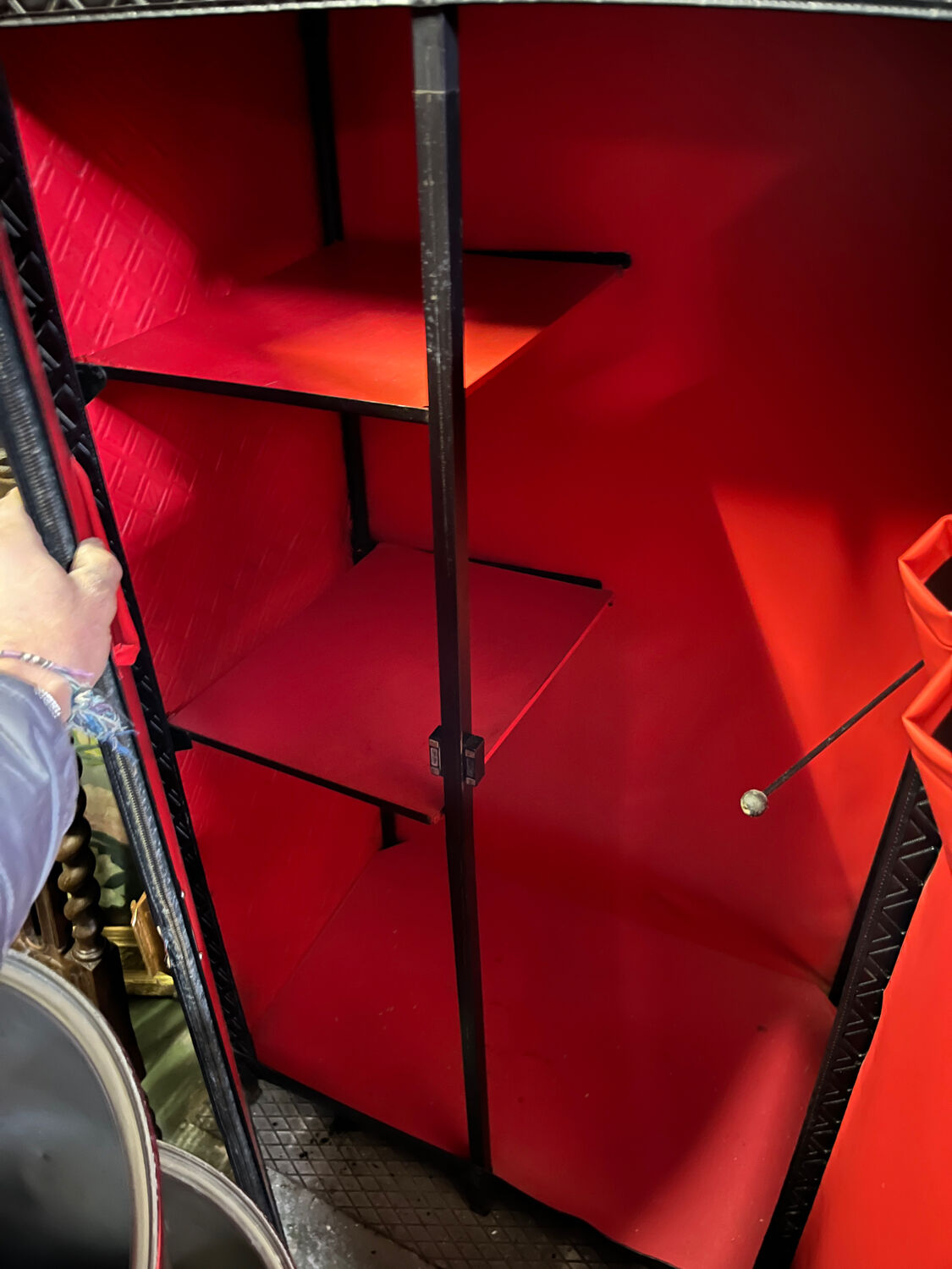 Contemporary wardrobe in black faux leather with diamond pattern and gold handles.