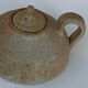 Vintage teapot in reeds