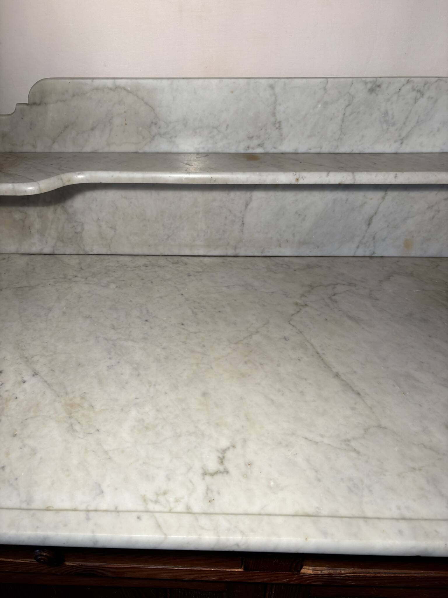 Antique wood and marble kitchen sideboard with carved backsplash