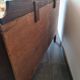 Dark wood sideboard with brass finishes and compass feet