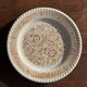 Set of 4 small dessert plates with a vintage stylised flower pattern.