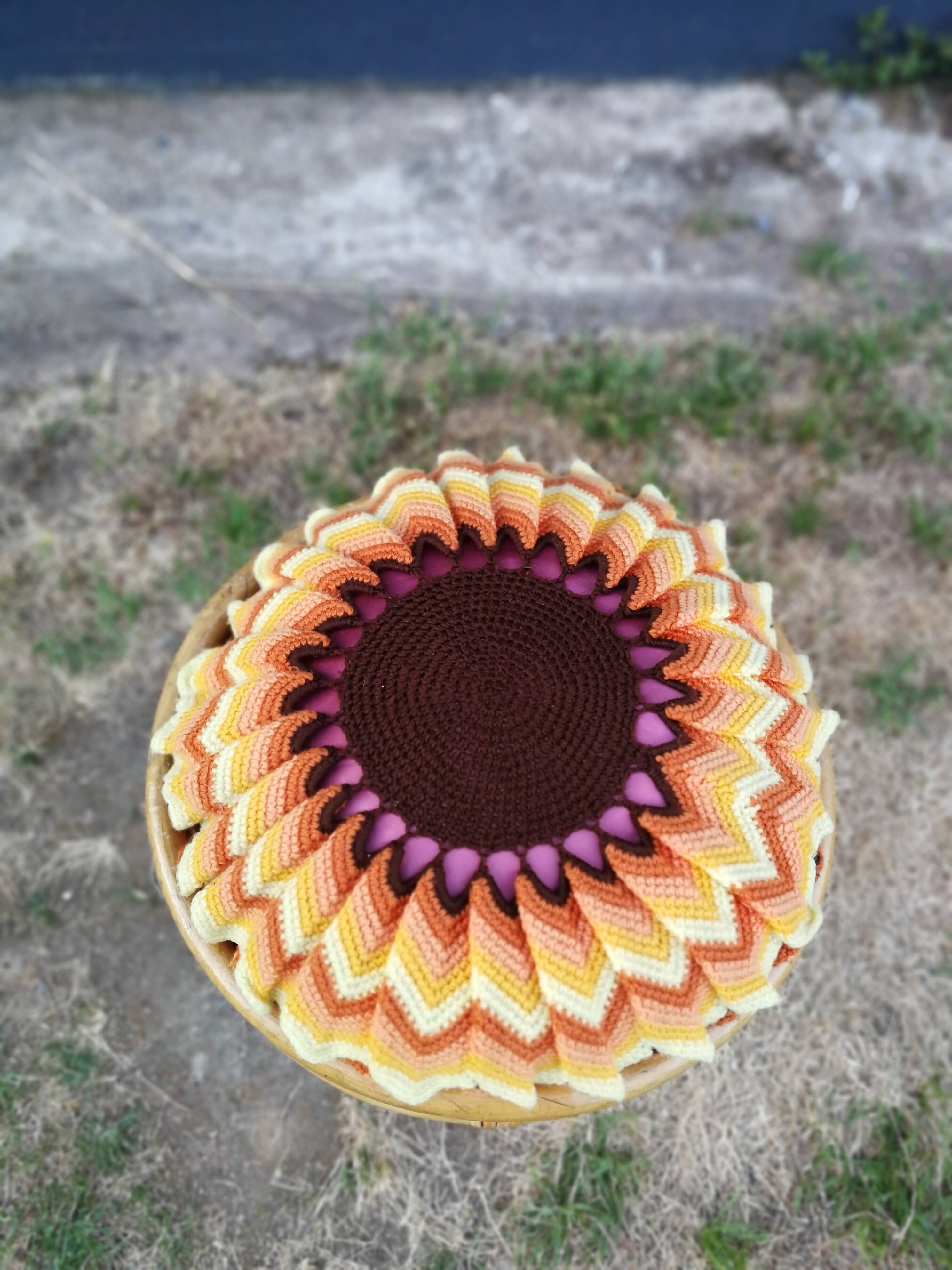 Rattan pouf and its 70's cushion