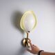 Arnold Wiigs wall lamp from plastic and brass