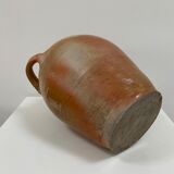 Ancient jar in varnished sandstone