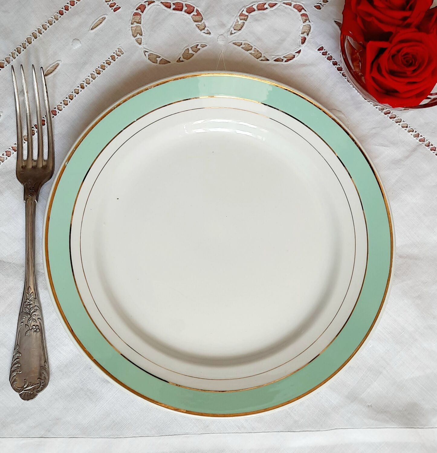 Flat earthenware plates with gilded edges
