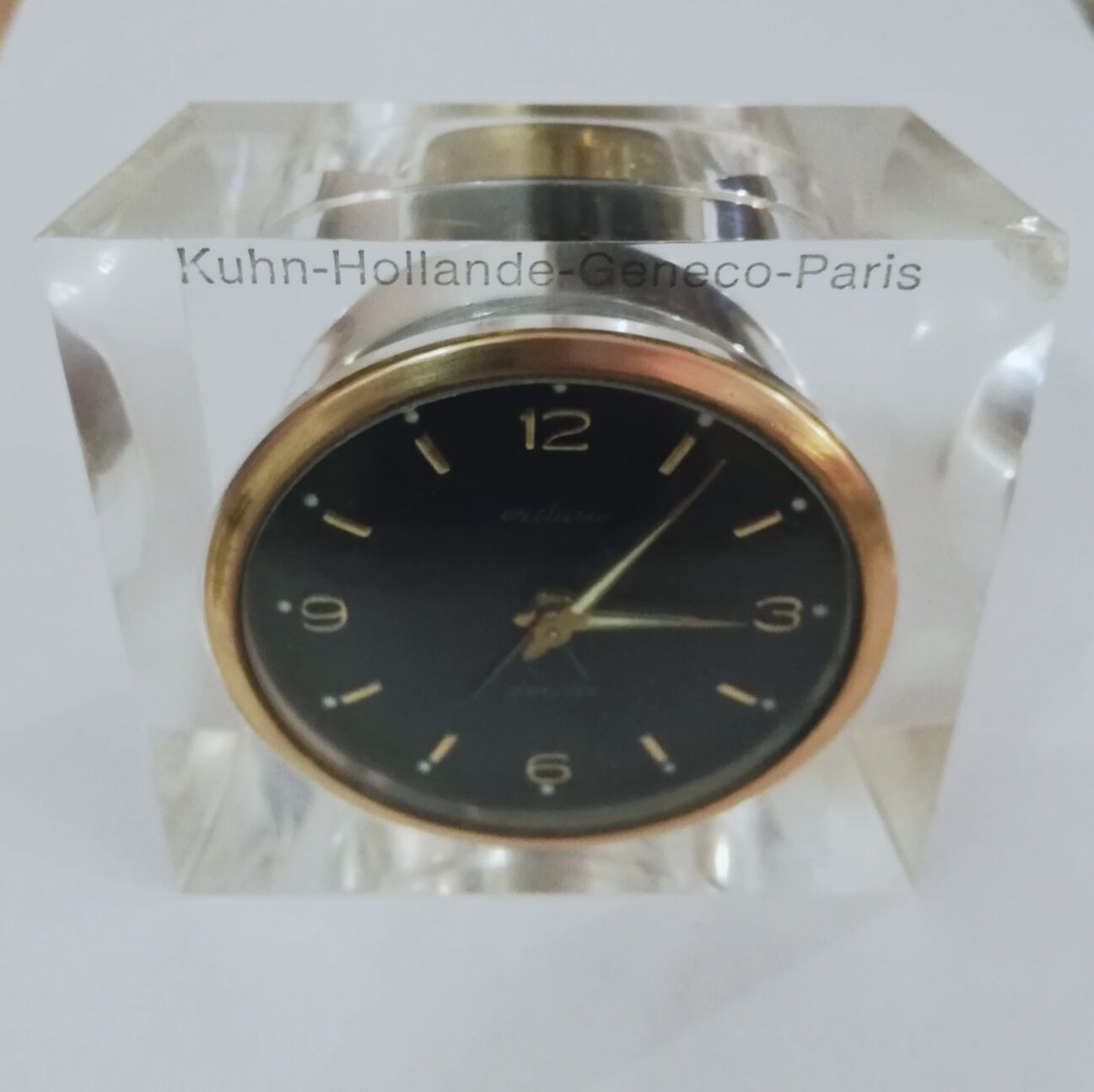 Alarm clock with exposed mechanism in plexiglass and brass