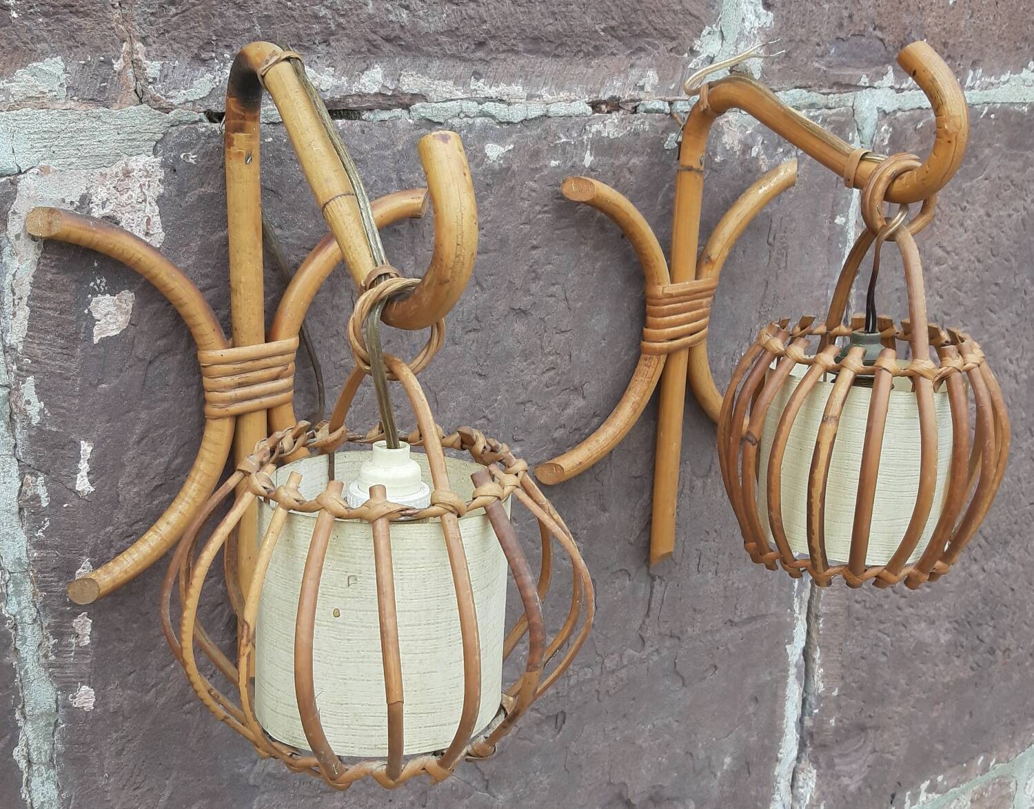 Pair of Louis Sognot rattan wall lights.