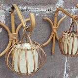 Pair of Louis Sognot rattan wall lights.