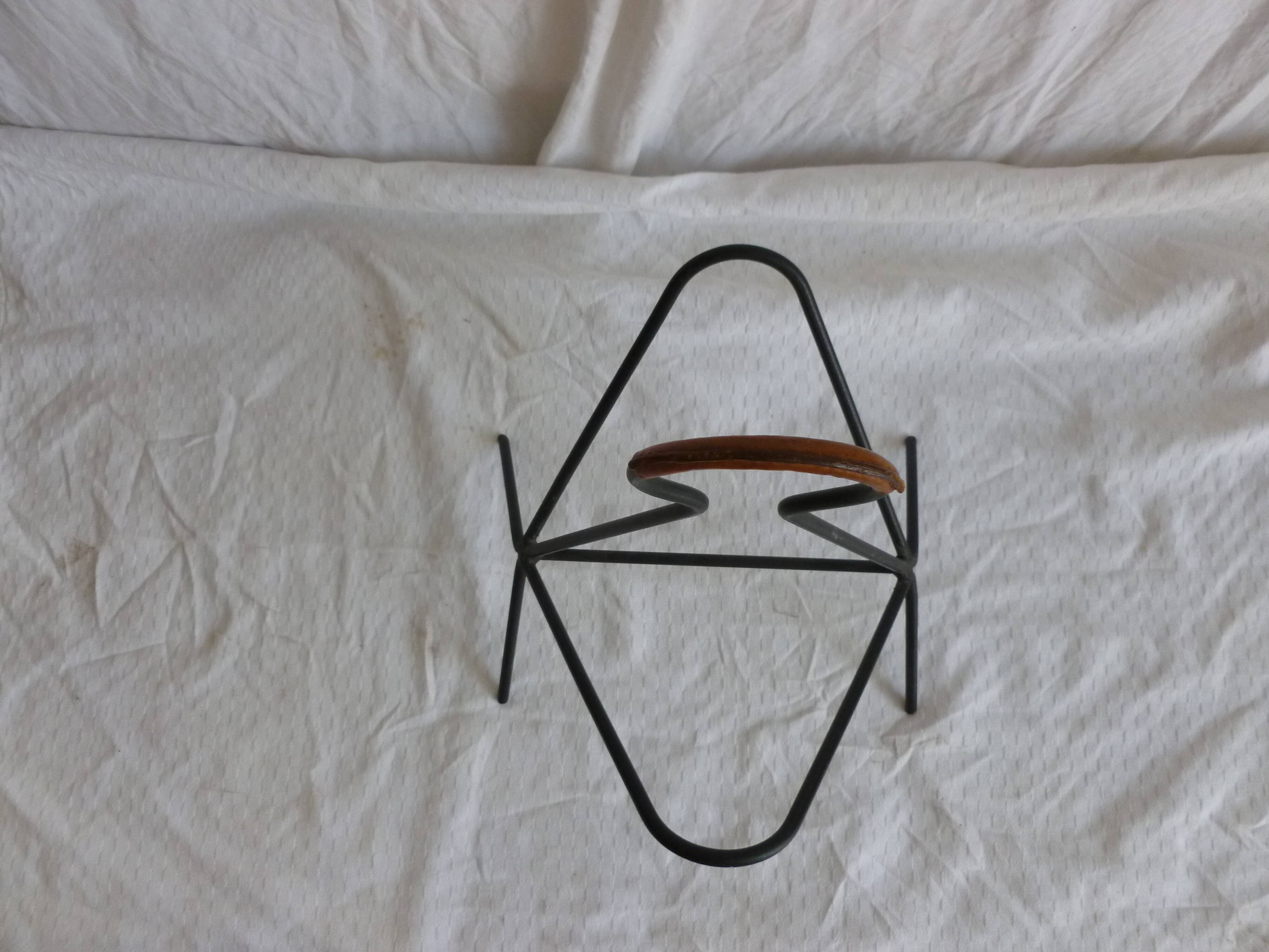 Leather-covered metal magazine holder