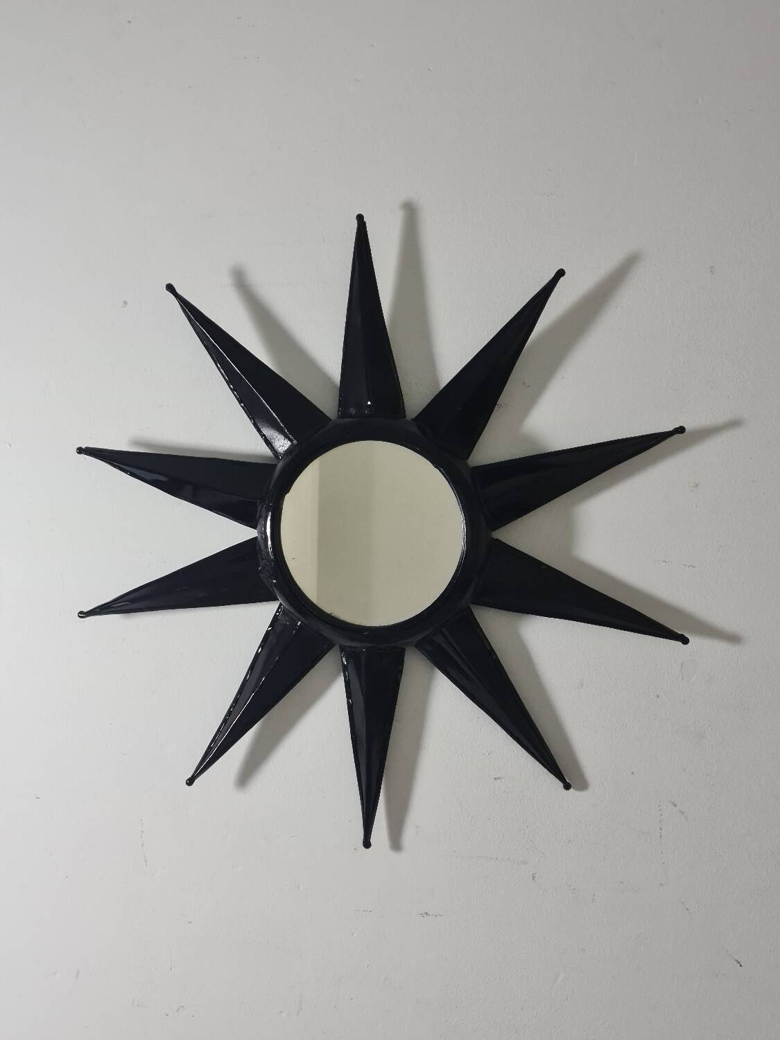 Antique metal star wall mirror black