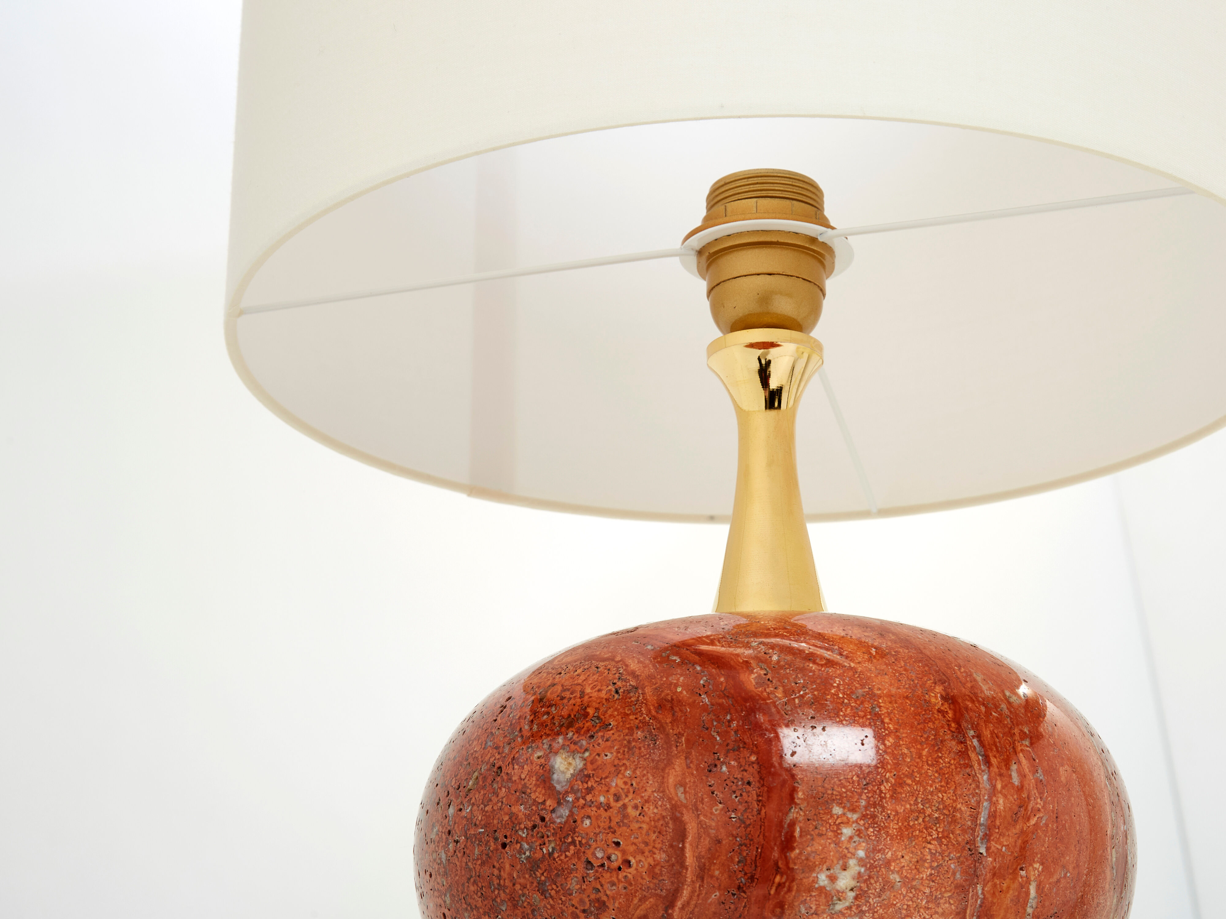 Pair of lamps in red travertine and brass 1970