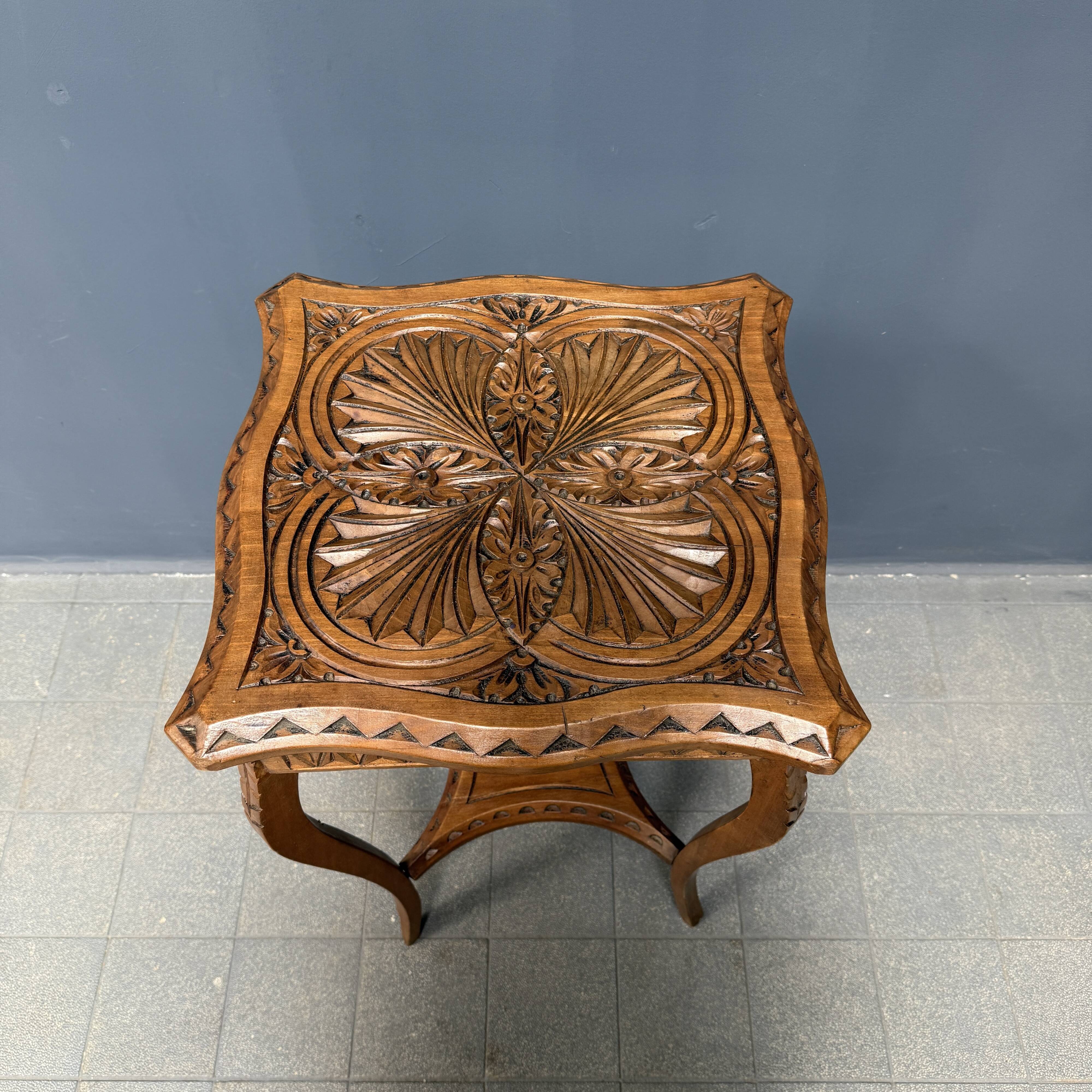 Graceful antique carved wooden side table