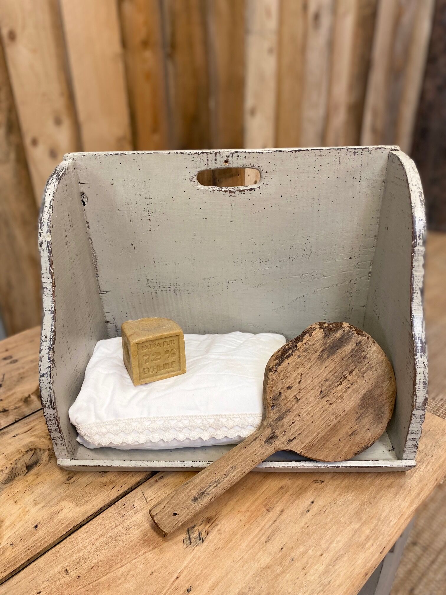 Old patinated washerwoman tray and its beater