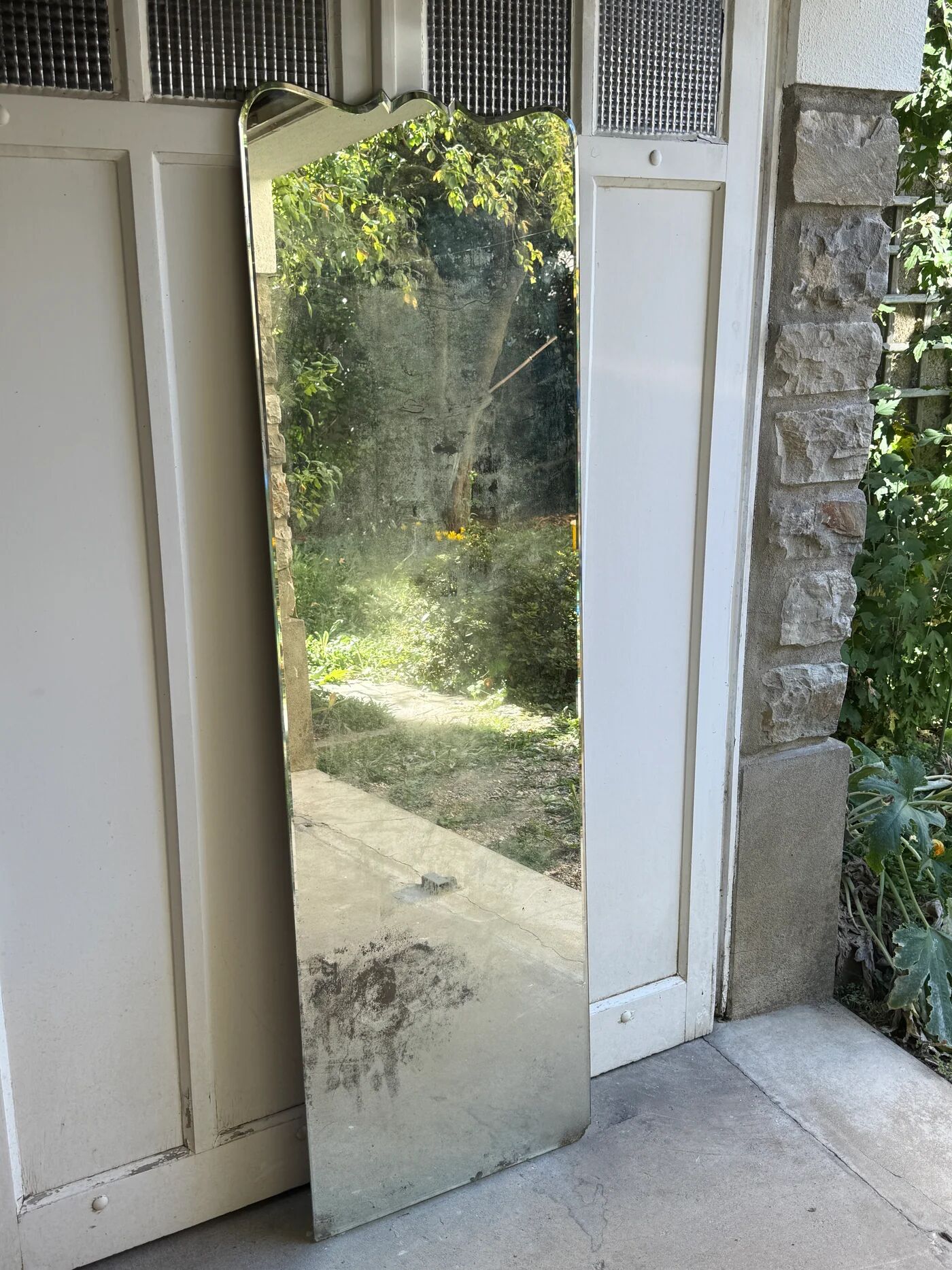 Large vintage mirror with bevelled glass.