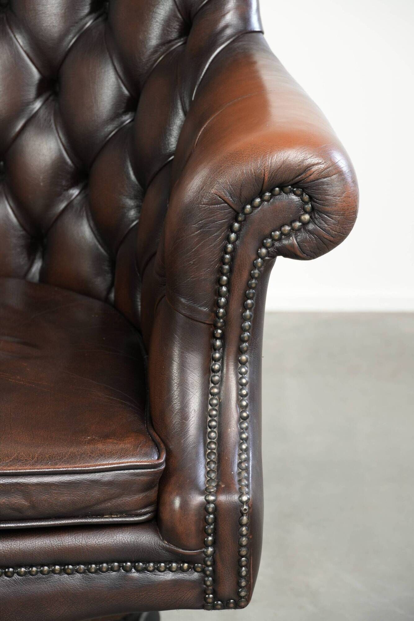 Brown cow leather Chesterfield office chair on wheels in English style
