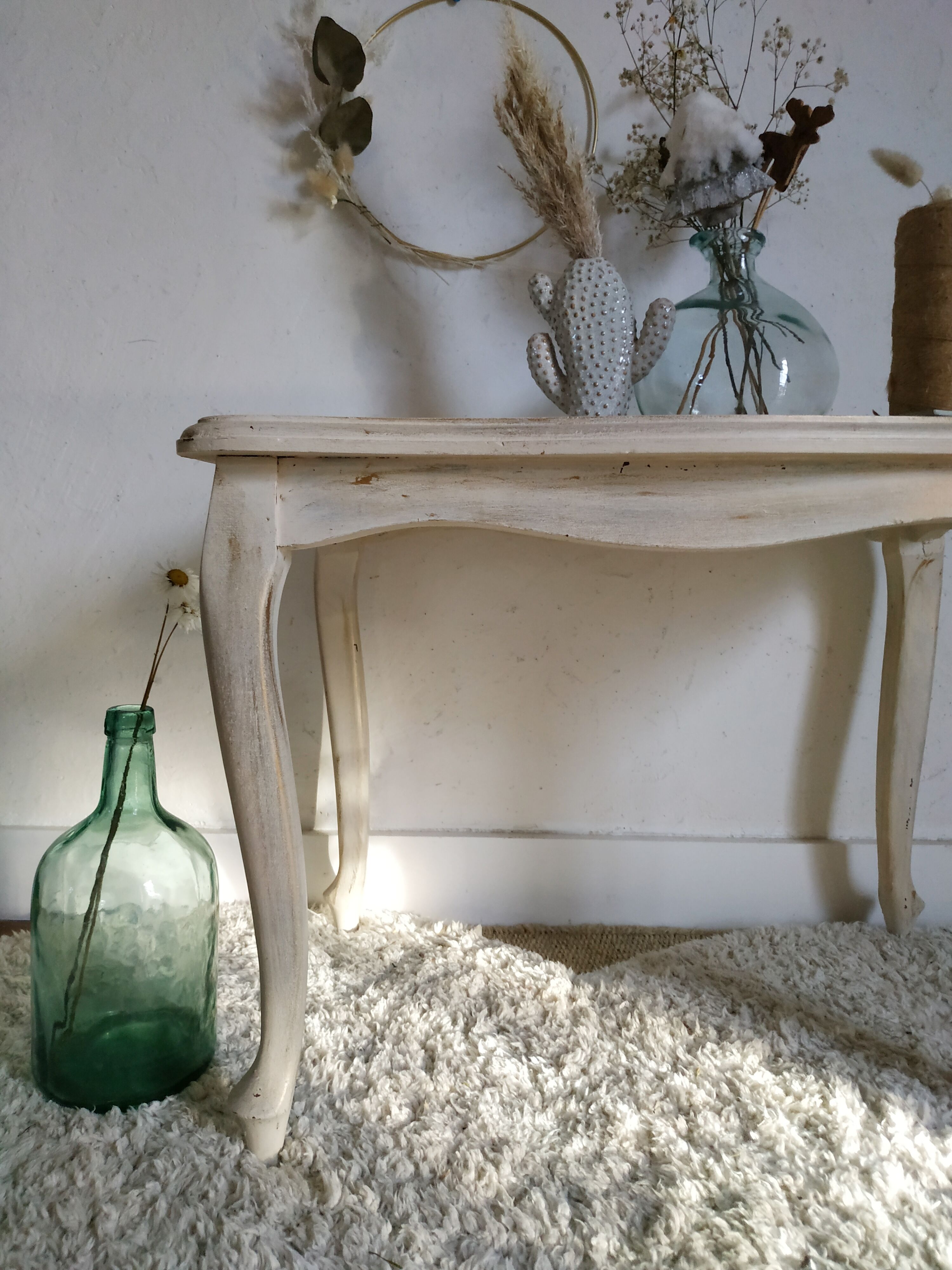 Old patinated coffee table and curved feet