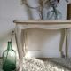 Old patinated coffee table and curved feet