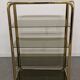 Hollywood Regency gilt metal and smoked glass shelf, Italy circa 1970