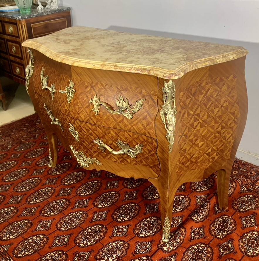 Louis XV chest of drawers, cubed rosewood marquetry, gilded bronzes, veined marble.
