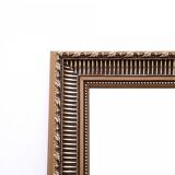 Unique mirror in a gold frame.