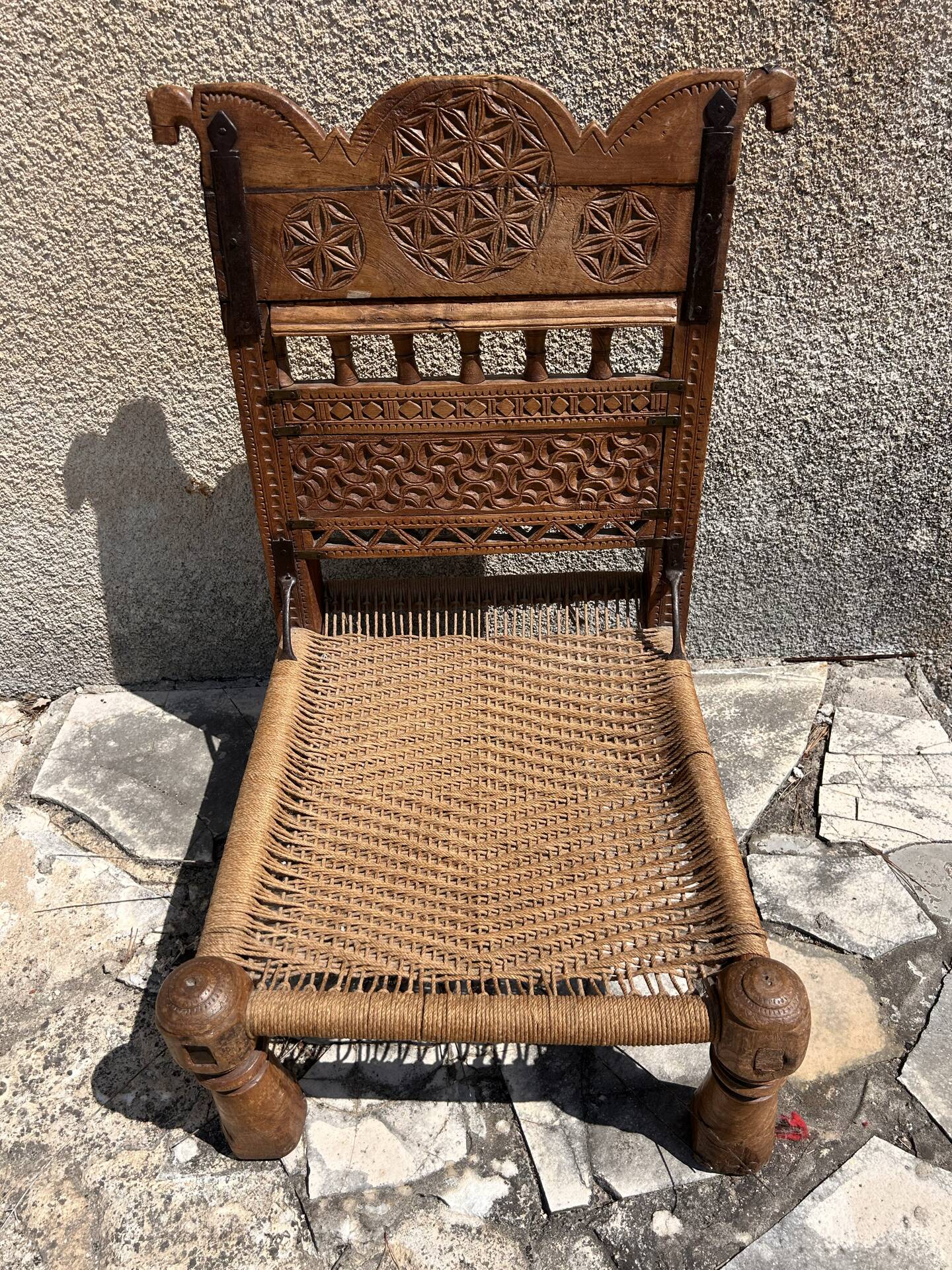 Antique ethnic chair in carved wood