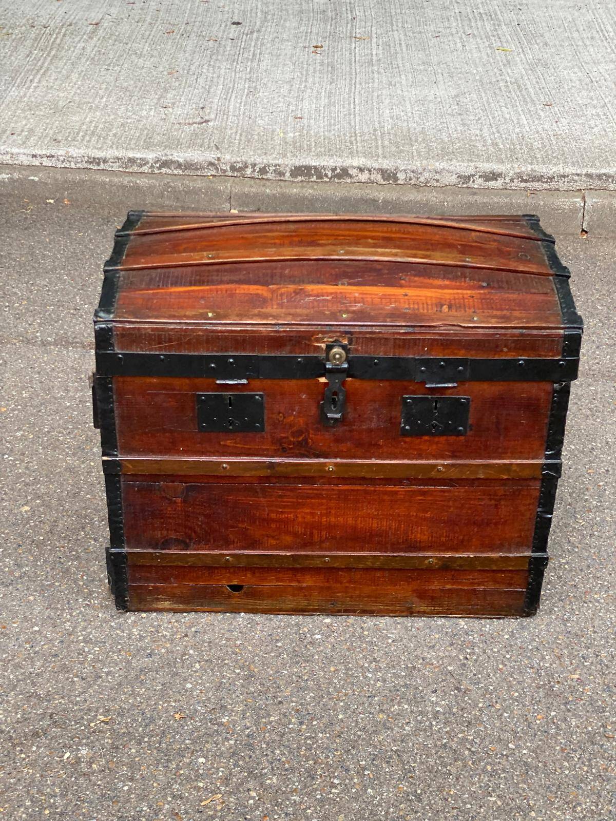Vintage domed travel trunk from the 19th century.
