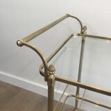Neoclassical brass rolling table with double glass tops