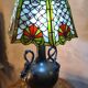 Caryatid lamp in bronze from 1900, Art Nouveau style, with a beautiful glass shade.