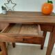Small antique solid wood table in chic country style with a drawer.